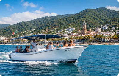 A tour boat carrying passengers along the Puerto Vallarta malecón and Banderas Bay