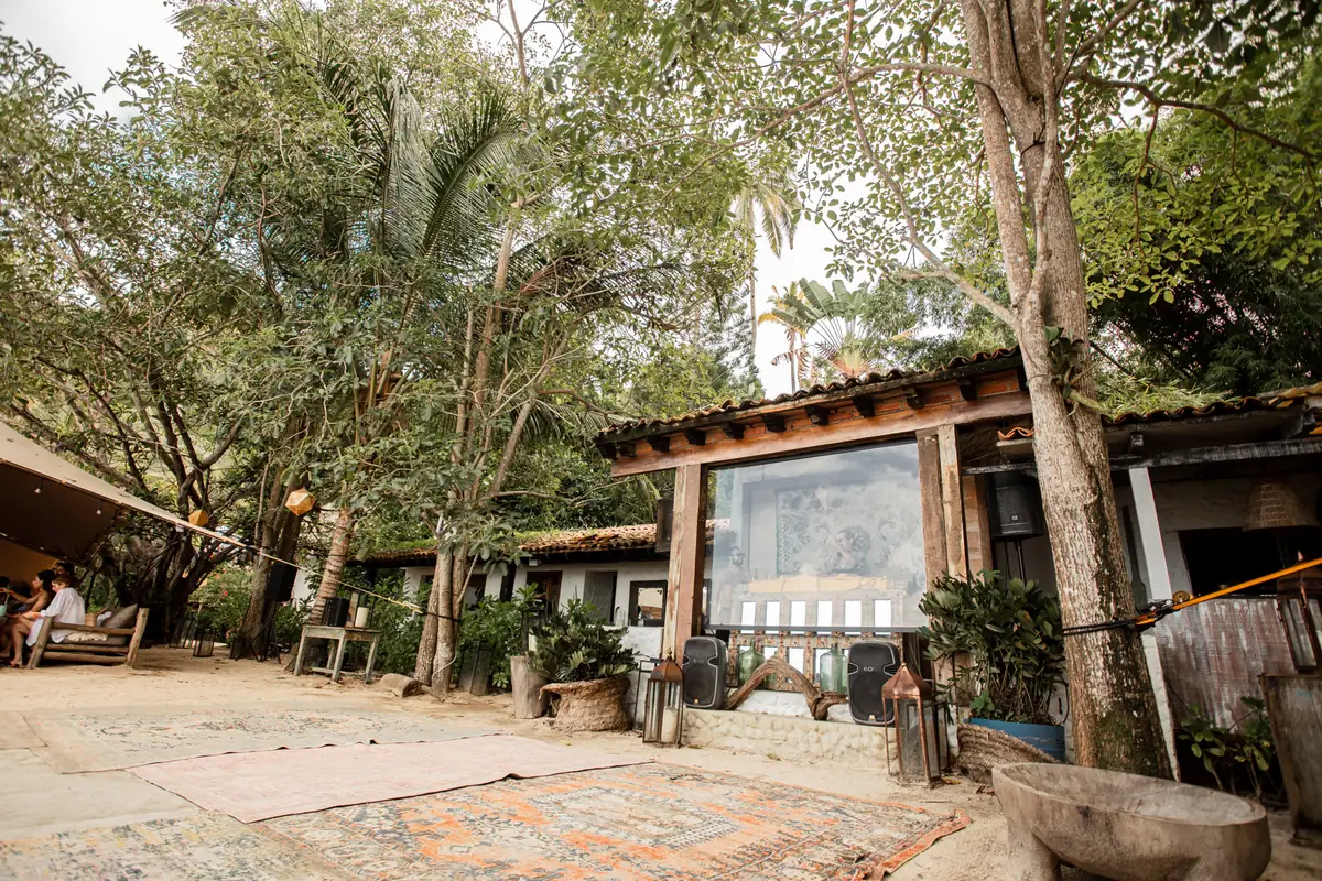 The open-sided bar and lounge structure at Majahuitas set back under the trees